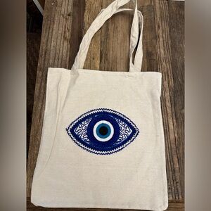 Brand new evil eye canvas tote bags.